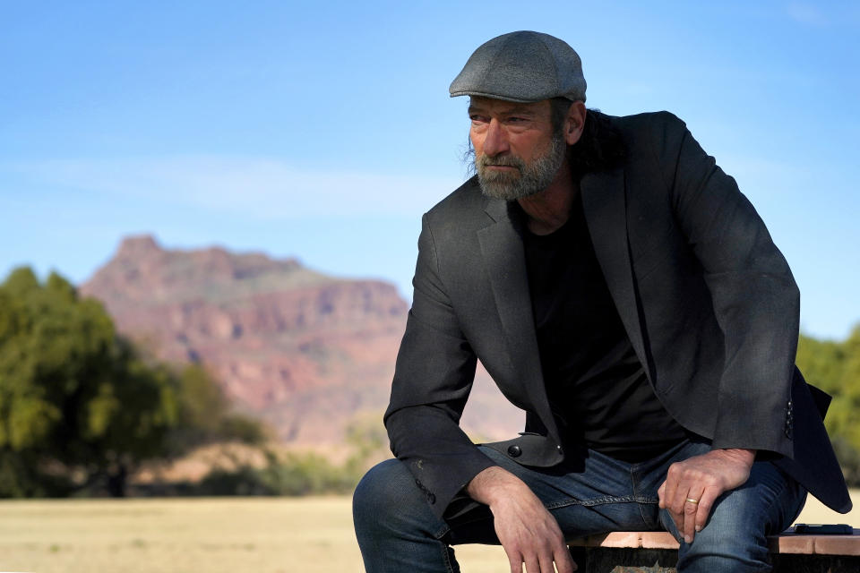 Troy Kotsur, nominated for an Oscar for best supporting actor for his role in the film "CODA," poses for a photo at Red Rock Park in Mesa, Ariz., on Jan. 28, 2022. (AP Photo/Matt York)