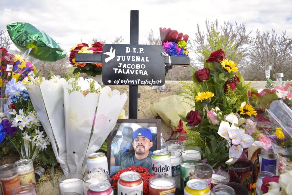 A cross in memory of Juvenal Jacobo Talavera stands at the base of the memorial for farm workers in Madera. Juvenal, 24, was the youngest of the seven farm workers killed in the crash Feb. 23.