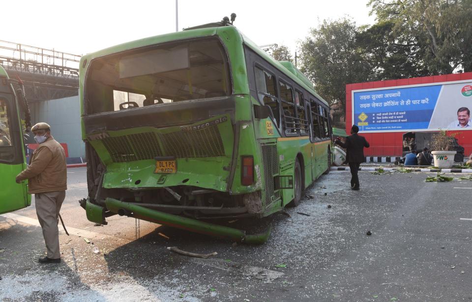 NEW DELHI, INDIA - JANUARY 26: A DTC bus damaged during violence after farmers on tractors entered the city on Republic Day at ITO on January 26, 2021 in New Delhi, India. Major scenes of chaos and mayhem at Delhi borders as groups of farmers allegedly broke barricades and police check posts and entered the national capital before permitted timings. Police used tear gas at Delhi's Mukarba Chowk to bring the groups under control. Clashes were also reported at ITO, Akshardham. Several rounds of talks between the government and protesting farmers have failed to resolve the impasse over the three farm laws. The kisan bodies, which have been protesting in the national capital for almost two months, demanding the repeal of three contentious farm laws have remained firm on their decision to hold a tractor rally on the occasion of Republic Day.(Photo by Arvind Yadav/Hindustan Times via Getty Images)