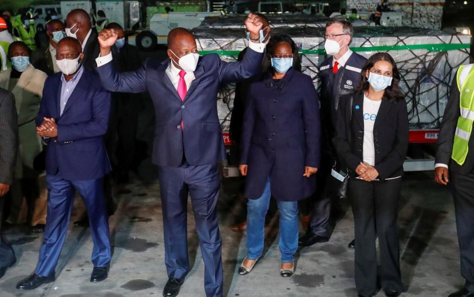 Kenya's Cabinet Secretary for Health Mutahi Kagwe reacts after receiving the first batch of AstraZeneca vaccines against the coronavirus disease  -  THOMAS MUKOYA/REUTERS