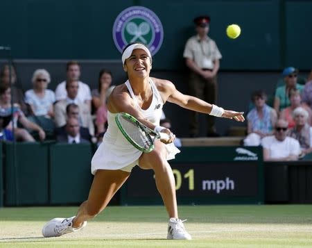 Heather Watson of Britain hits a shot during her match against Serena Williams of the U.S.A. at the Wimbledon Tennis Championships in London, July 3, 2015. REUTERS/Suzanne Plunkett