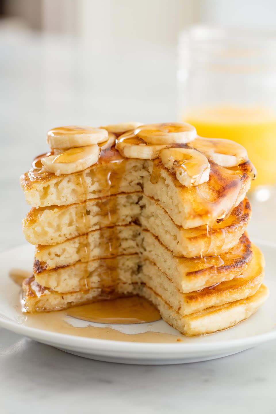 <p>Fluffy vegan pancakes are 100% possible. And trust us, you won't miss milk, butter, or eggs. These are the ingredients that make all the difference: non-dairy milk, baking powder, and coconut oil. (Bonus: Its high smoke point means you're less likely to burn that first pancake, woohoo!)</p><p>Get the <strong><a href="https://www.delish.com/cooking/recipe-ideas/recipes/a58451/easy-vegan-pancake-recipe/" rel="nofollow noopener" target="_blank" data-ylk="slk:Fluffy Vegan Pancakes recipe;elm:context_link;itc:0;sec:content-canvas" class="link ">Fluffy Vegan Pancakes recipe</a></strong>.</p>