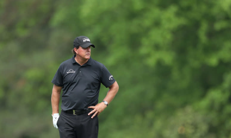 Phil Mickelson standing on the green at The Masters, one of four PGA majors..