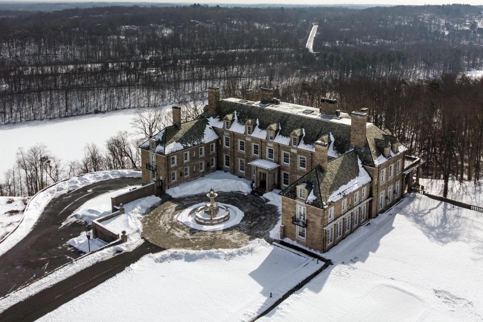 FILE — The Seven Springs, a property owned by former U.S. President Donald Trump, is covered in snow, Feb. 23, 2021, in Mount Kisco, N.Y. Cushman & Wakefield, that has performed hundreds of property appraisals for Donald Trump, has been held in contempt of court for missing a deadline to turn over documents in the New York attorney general's civil investigation into the former president's business practices. (AP Photo/John Minchillo, File)