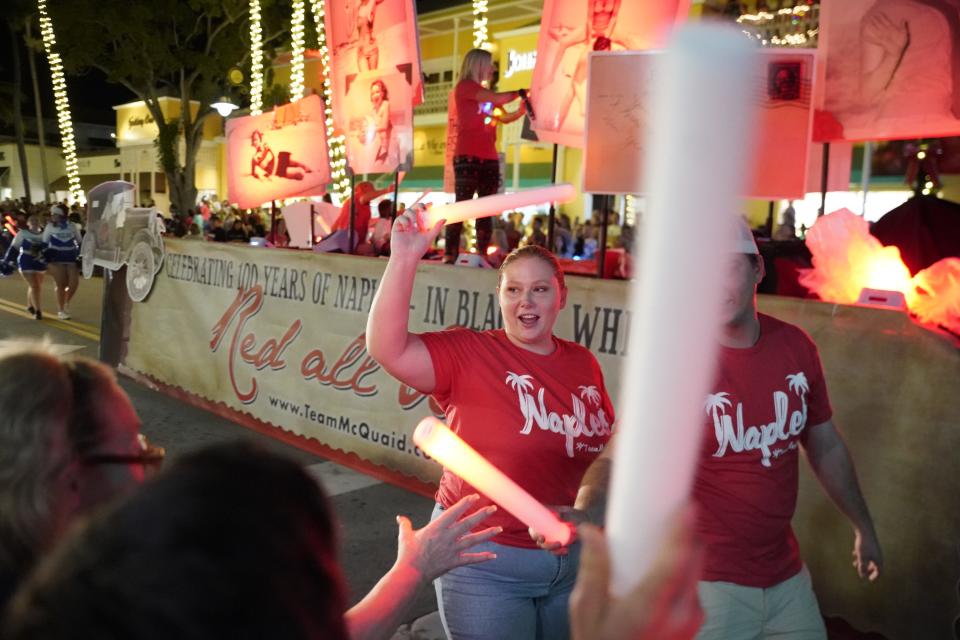 People take part in the annual Naples Christmas Parade along Fifth Avenue South in Naples on Tuesday, Dec. 6, 2022.