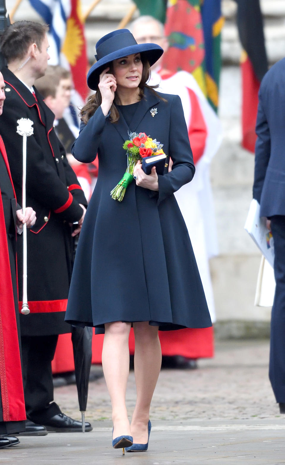 <p><strong>The occassion:</strong> At the 2018 Commonwealth Day service at Westminster Abbey.<br><strong>The look:</strong> A navy Beulah coat wit Rupert Sanderson heels and a Jimmy Choo clutch. <br>[Photo: Getty] </p>