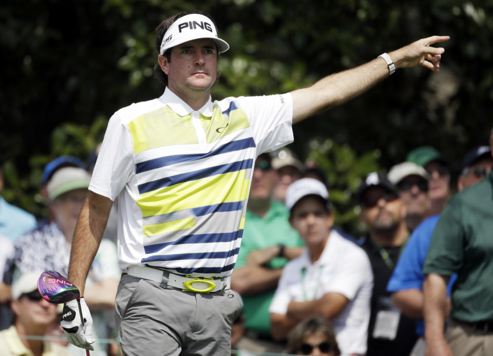 Bubba Watson points to his tee shot on the ninth hole during the second round of the Masters golf tournament Friday, April 11, 2014, in Augusta, Ga. (AP Photo/Darron Cummings)