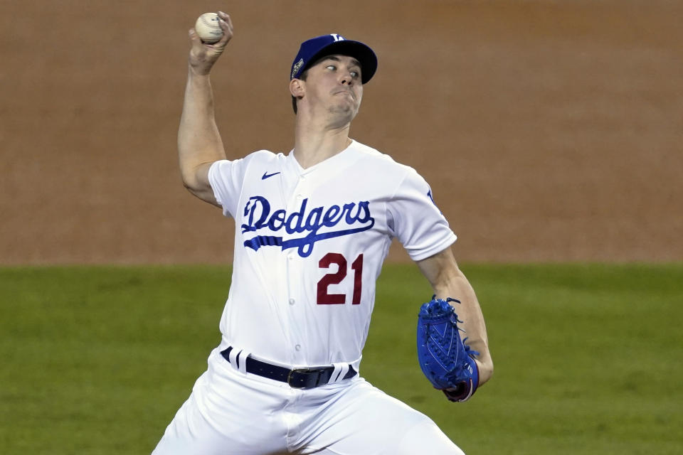 FILE - Sept. 30, 2020, Los Angeles Dodgers starting pitcher Walker Buehler throws to a Milwaukee Brewers batter during the third inning in Game 1 of a National League wild-card baseball series in Los Angeles. The San Diego Padres have already had a grand time in the new Texas ballpark, and after a lot of postseason relief are back there for another chance to overtake the Dodgers. (AP Photo/Ashley Landis, File)