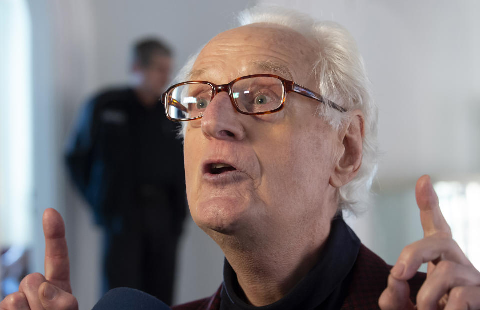 Plaintiff Michael Duellmann gestures prior to a trial at the Higher Regional Court in Naumburg, Germany, Tuesday, Jan. 21, 2020. The city of Wittenberg contains a Judensau (Jew-Pig) on the facade of the Stadtkirche (Town Church). The court will consider a Jewish man's bid to force the removal of an ugly remnant of centuries of anti-Semitism from a church where Martin Luther once preached. (AP Photo/Jens Meyer)