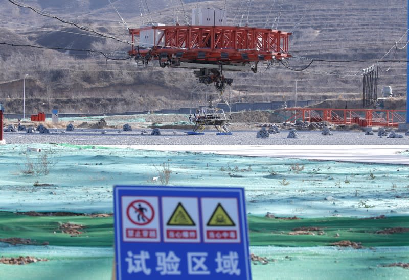 A lander for China's Mars mission is seen before a hovering-and-obstacle avoidance test at a test facility in Huailai