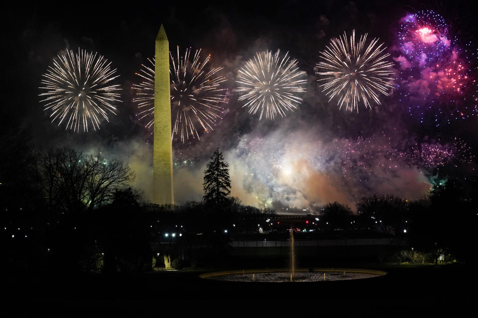 Fireworks light up the sky by the Washington Monument during inauguration ceremonies Wednesday, Jan. 20, 2021, in Washington. (AP Photo/Evan Vucci)