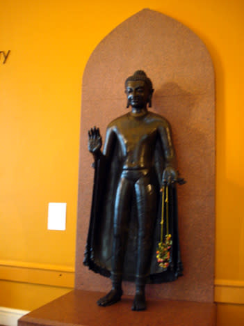 <p>The Sultanganj Buddha is 2.3m high and 1m at its widest point and weighs about 500kgs. It was cast by the technique known as the 'lost wax' process, in which a solid core of clay is overlaid with wax. The sculptor models the fine details in the wax coating. The wax is covered with a liquid layering of clay and plaster which hardens to form a mould. When heat is applied the wax melts and molten metal is poured in. The finished statue is finally obtained by removing the outer casting when cool.<br><em>Next slide: 30000 people came to see it in Bihar.</em></p>