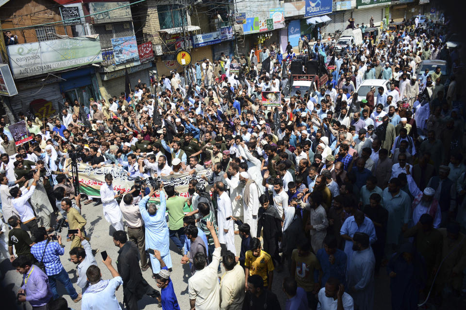 Pakistani Kashmiris rally to observe Black Day on the occasion of India's Independence Day in Muzaffarabad, capital of Pakistani Kashmir, Thursday, Aug. 15, 2019. Pakistan's prime minister has questioned the silence of world community over recent change in the status of Indian-administered sector of Kashmir by New Delhi and lingering imposition of security clampdown which deprived Kashmiri people of their basic rights. (AP Photo/M.D. Mughal)