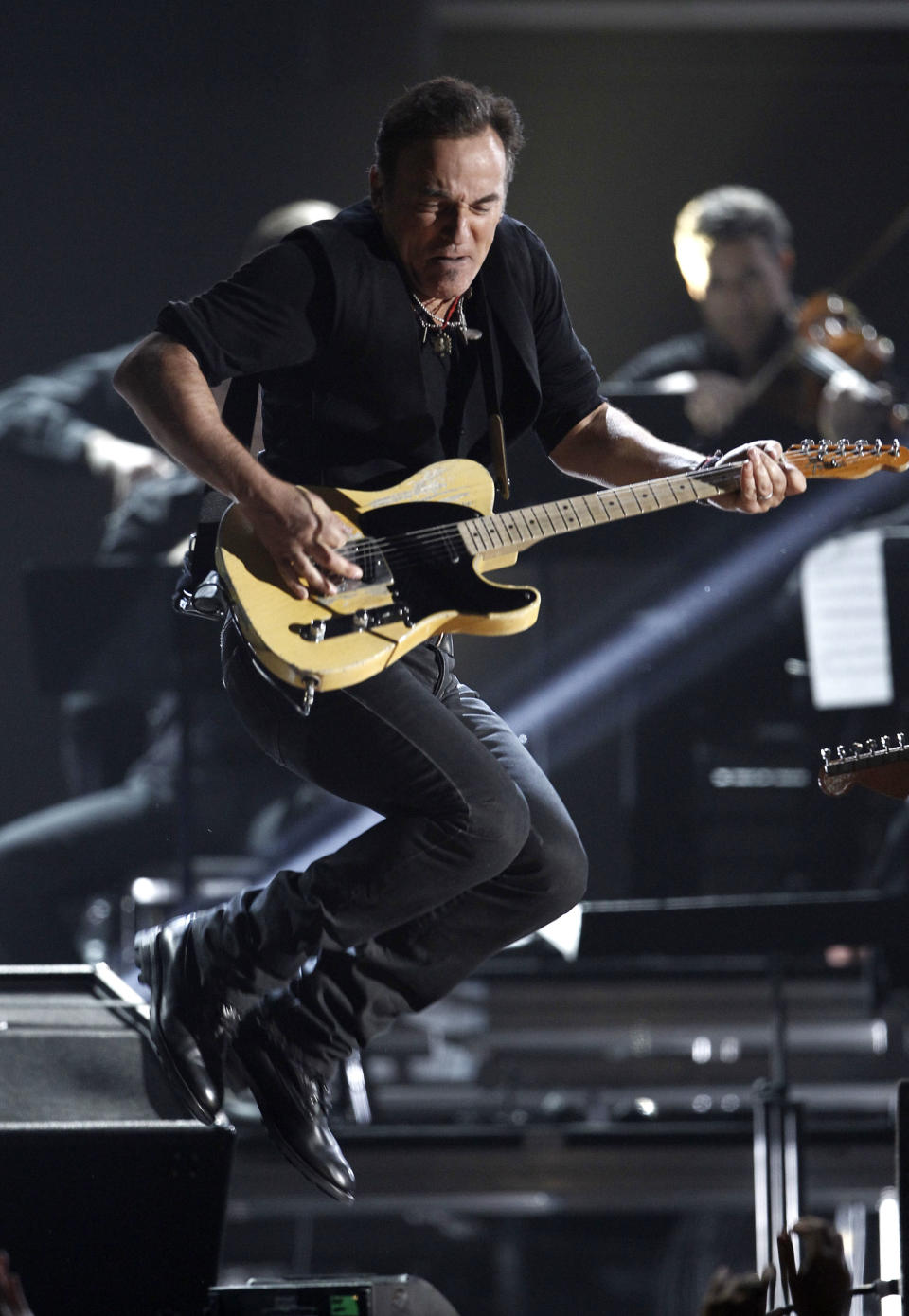 FILE - In this Feb. 12, 2012 file photo, Bruce Springsteen performs during the 54th annual Grammy Awards in Los Angeles. Springsteen will perform at the annual South by Southwest Conference and Festival in Austin, Texas. (AP Photo/Matt Sayles, file)