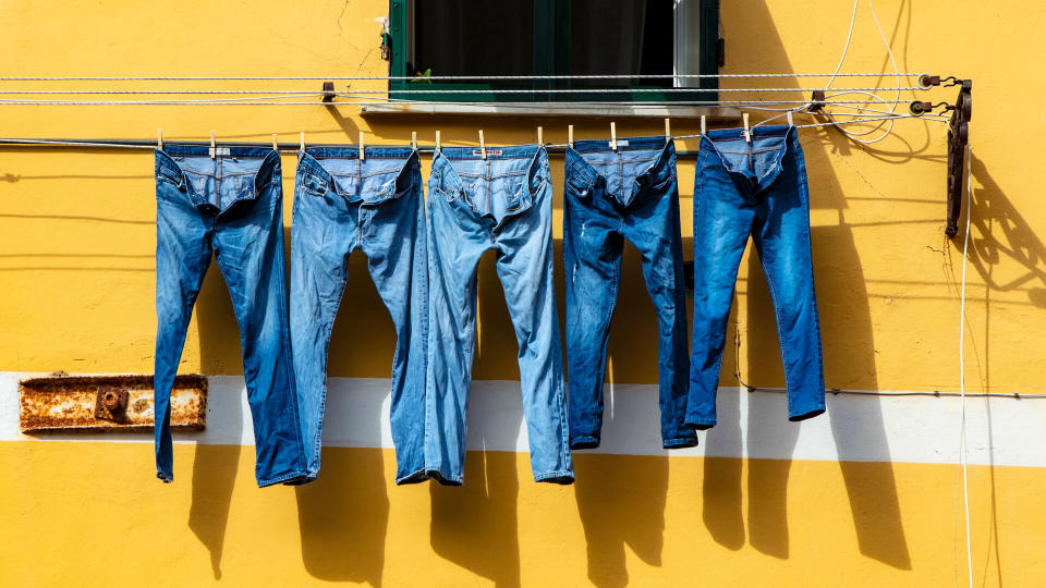 jeans hanging on a clothes dry line