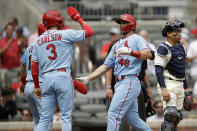 St. Louis Cardinals' Paul Goldschmidt (46) is congratulated by Dylan Carlson (3) after hitting a three-run home run off Atlanta Braves' Josh Tomlin during the fifth inning of the first baseball game of a doubleheader on Sunday, June 20, 2021, in Atlanta. (AP Photo/Ben Margot)