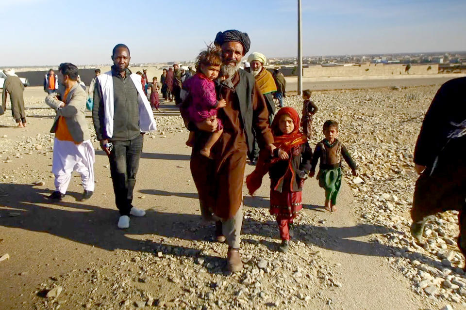 Benazir, 8, second right, walks with a group in Herat, Afghanistan.  (NBC News)