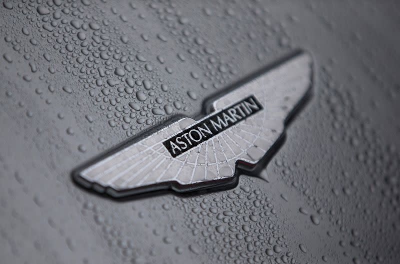 FILE PHOTO: The badge of an Aston Martin DB10 is displayed at a UK Trade and Investment event in London, Britain