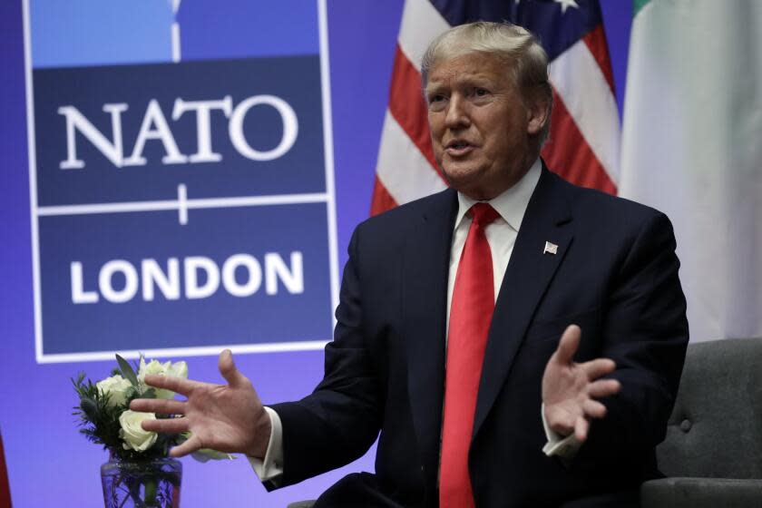 FILE - President Donald Trump meets with Italian Prime Minister Giuseppe Conte during the NATO summit at The Grove, Wednesday, Dec. 4, 2019, in Watford, England. Former US president Donald Trump says he once warned that he would allow Russia to do whatever it wants to NATO member nations that are "delinquent" in devoting 2% of their gross domestic product to defense. Trump's comment on Saturday represented the latest instance in which the former president and Republican front-runner seemed to side with an authoritarian state over America's democratic allies. (AP Photo/ Evan Vucci, File)