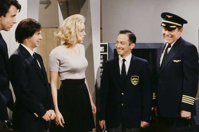 <p>Alan Singer/NBCU Photo Bank</p> Kevin Nealon, Dana Carvey, Sharon Stone, Rob Schneider and Phil Hartman on 'Saturday Night Live' on April 11, 1992