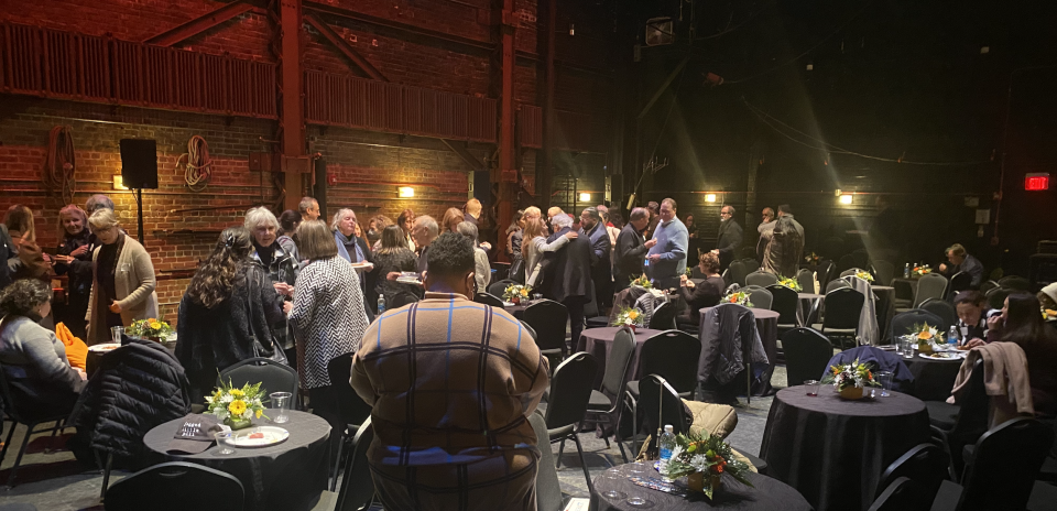 Members from the New Bedford community dined on Domino's pizza on the Zeiterion stage Thursday, to honor Nelson Hockert-Lotz.