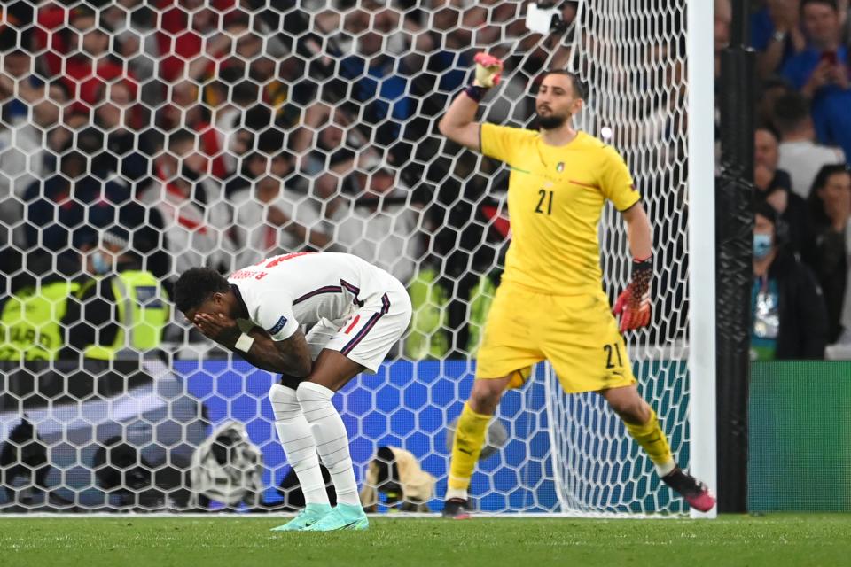 England's Marcus Rashford reacts after missed a penalty shot during the penalty shootout (AP)