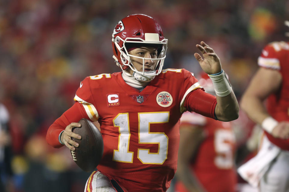 Kansas City Chiefs quarterback Patrick Mahomes (15) scrambles up field during the second half of an NFL wild-card playoff football game against the Pittsburgh Steelers, Sunday, Jan. 16, 2022, in Kansas City, Mo. (AP Photo/Travis Heying)