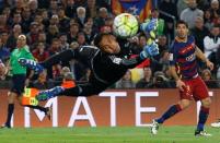 Football Soccer - FC Barcelona v Real Madrid - La Liga - Camp Nou, Barcelona - 2/4/16 Barcelona's Luis Suarez shoots at goal past Real Madrid's Keylor Navas Reuters / Albert Gea Livepic