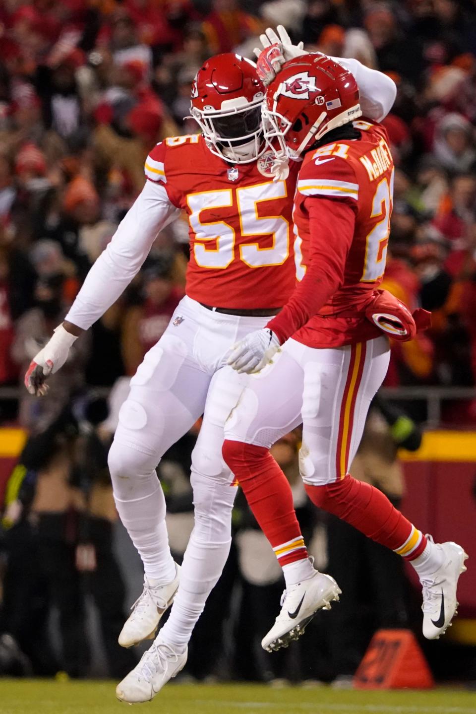 Kansas City Chiefs defensive end Frank Clark (55) celebrates with teammate cornerback Trent McDuffie (21) after sacking Cincinnati Bengals quarterback Joe Burrow during the first half of the NFL AFC Championship game on Sunday, Jan. 29, 2023, in Kansas City, Mo. (AP Photo/Ed Zurga)