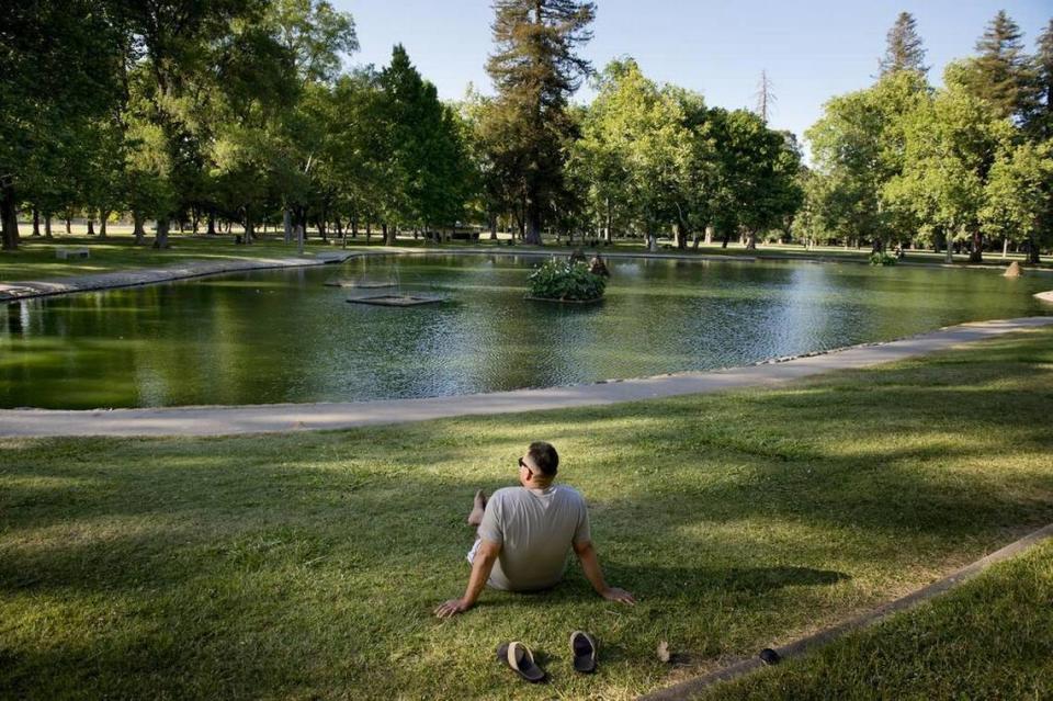 David Garcia listens to music as he enjoys the afternoon near the pond in William Land Park across from the Sacramento Zoo on June 2, 2014. Jose Luis Villegas/jvillegas@sacbee.com