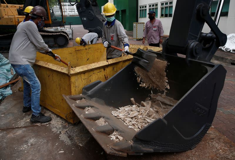 Ivory, seized from various shipments in past years, is crushed by the National Parks Board (NParks) at a facility in Singapore