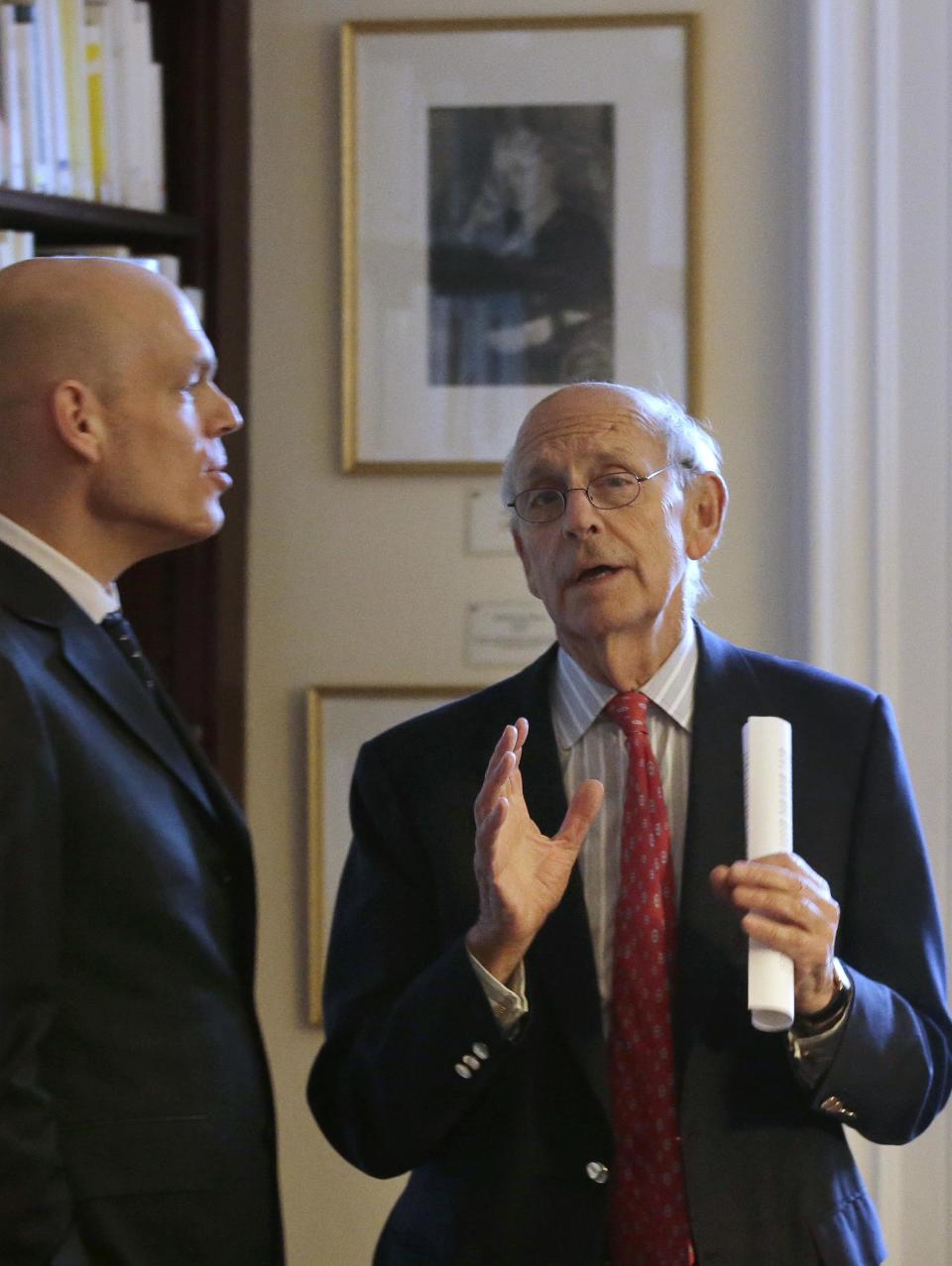 United States Supreme Court Justice Stephen Breyer, right, speaks with Harvard professor Holger Spamann, left, at the French Cultural Center, Monday, Feb. 13, 2017, in Boston, while touring the center before participating in a forum called From the Bench to the Sketchbook. (AP Photo/Steven Senne)