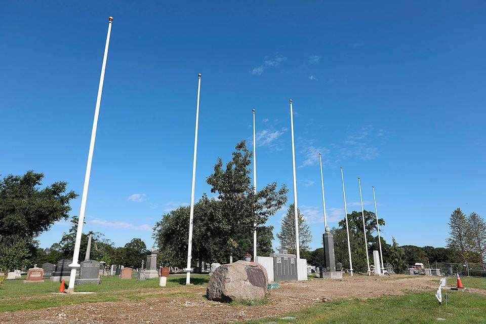 New flagpoles at Mount Wollaston Cemetery honor each branch of the military.