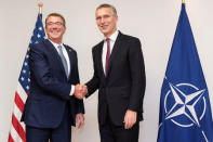 U.S. Defense Secretary Ashton Carter (L) poses with NATO Secretary-General Jens Stoltenberg during a NATO defence ministers meeting at the Alliance headquarters in Brussels, Belgium, October 26, 2016. REUTERS/Geert Vanden Wijngaert/Pool