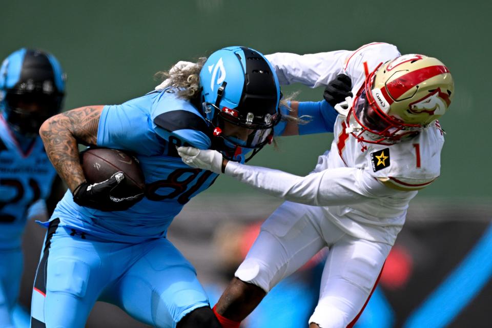 Birmingham Stallions defensive back Chris Jackson (1) tackles Arlington Renegades tight end Sal Cannella (80) during the second half of the UFL season opener at Choctaw Stadium.