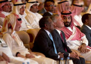 Saudi Crown Prince, Mohammed bin Salman, right, looks at Saudi billionaire Prince Alwaleed bin Talal, left, while seated next to Jordan's King Abdullah II, during the Future Investment Initiative conference, in Riyadh, Saudi Arabia, Tuesday, Oct. 23, 2018. The high-profile economic forum in Saudi Arabia is the kingdom's first major event on the world stage since the killing of writer Jamal Khashoggi at the Saudi Consulate in Istanbul earlier this month. (AP Photo/Amr Nabil)