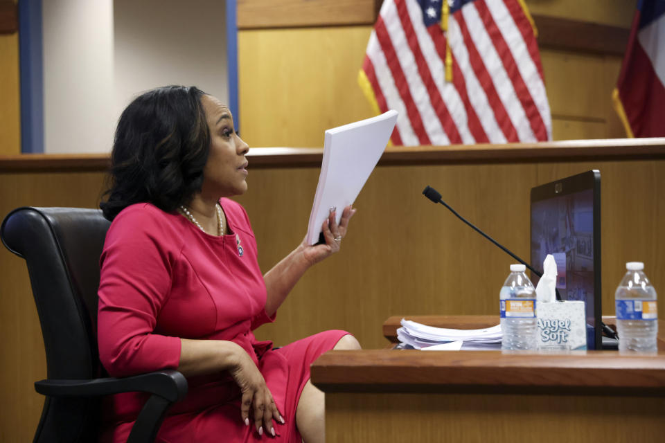 Fulton County District Attorney Fani Willis testifies during a hearing on the Georgia election interference case, Thursday, Feb. 15, 2024, in Atlanta. The hearing is to determine whether Willis should be removed from the case because of a relationship with Nathan Wade, special prosecutor she hired in the election interference case against former President Donald Trump. (Alyssa Pointer/Pool Photo via AP)