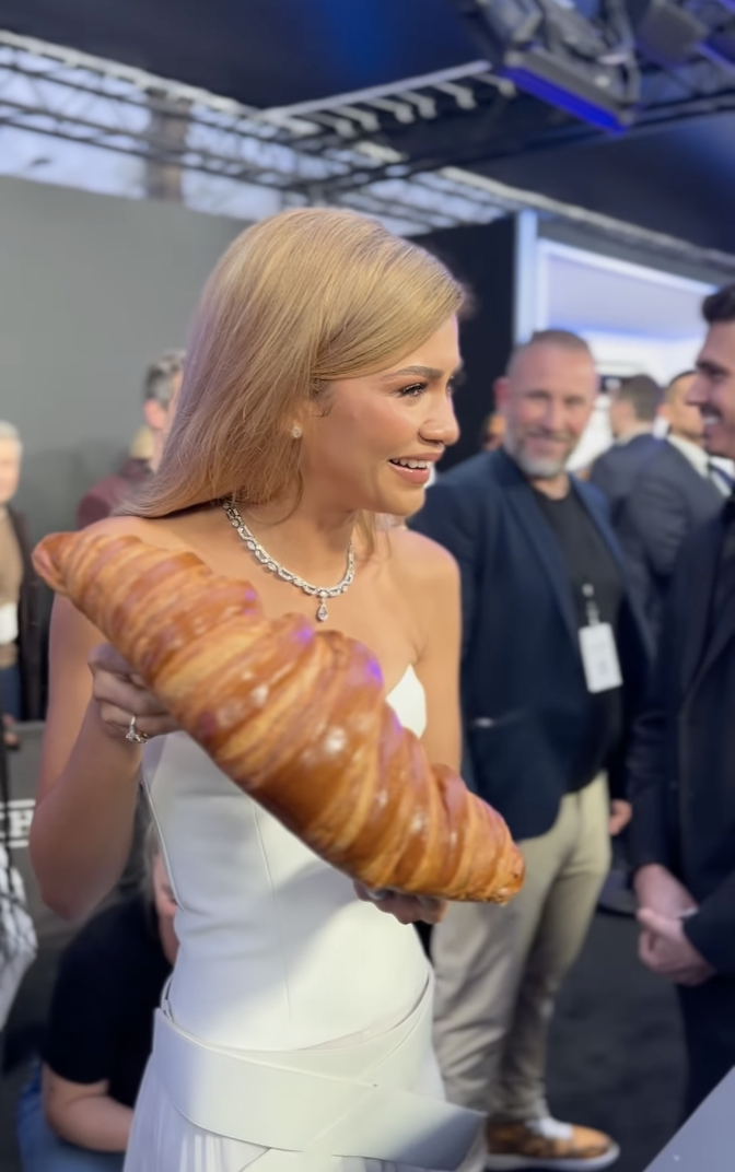 Zendaya holding a giant croissant