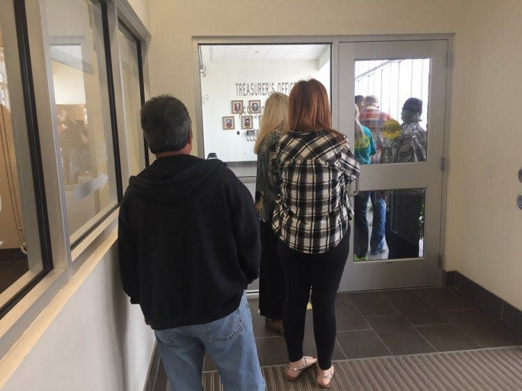 Voters wait in line on Election Day at the Eddy County sub office in Artesia.