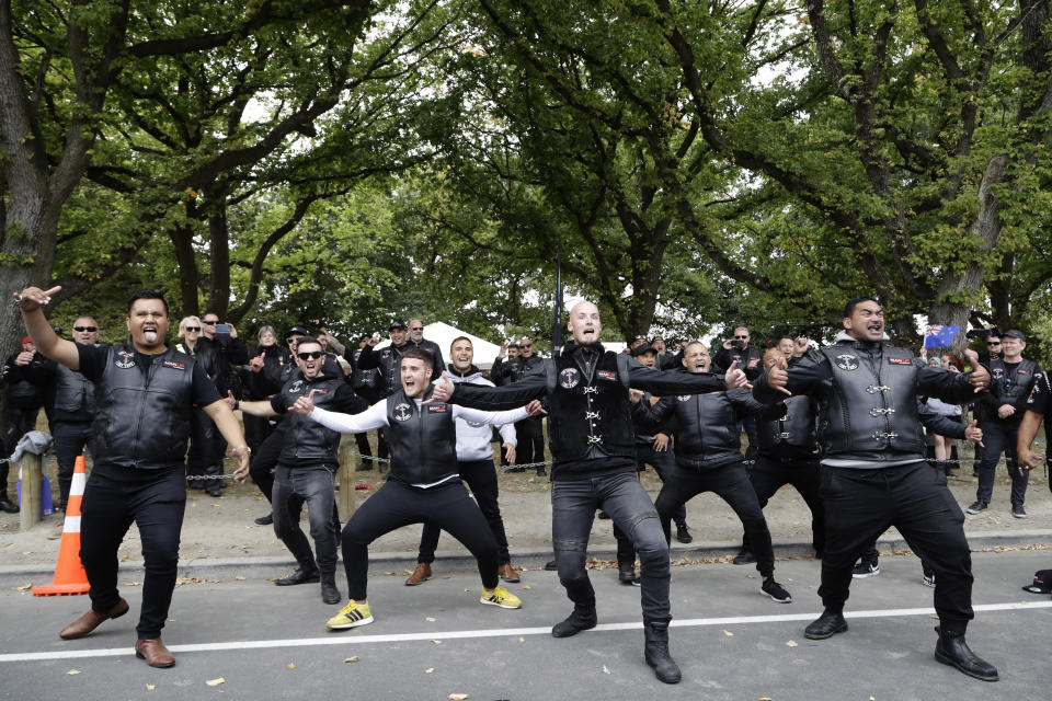 Members of the Tu Tangata motorcycle club perform a haka outside the Al Noor mosque in Christchurch, New Zealand, Sunday, March 15, 2020. A national memorial in New Zealand to commemorate the 51 people who were killed when a gunman attacked two mosques one year ago has been canceled due to fears over the new coronavirus. (AP Photo/Mark Baker)