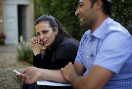 Syrian couple Hassan Zaheda, 31, and Nour Essa (L), 30, talk during an interview with Reuters at the Sant'Egidio community in Rome, Italy, April 20, 2016. REUTERS/Max Rossi