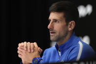 Novak Djokovic of Serbia reacts during a press conference following his loss to Jannik Sinner of Italy in their semifinal at the Australian Open tennis championships at Melbourne Park, Melbourne, Australia, Friday, Jan. 26, 2024. (AP Photo/Louise Delmotte)