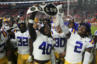 LSU players celebrate after defeating Auburn in an NCAA college football game, Saturday, Oct. 1, 2022, in Auburn, Ala. (AP Photo/John Bazemore)