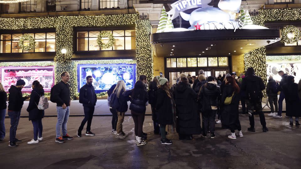 Customers wait in line before the store opens for early morning Black Friday sales outside Macy's Herald Square on November 24, 2023 in New York, New York. - Kena Betancur/Getty Images