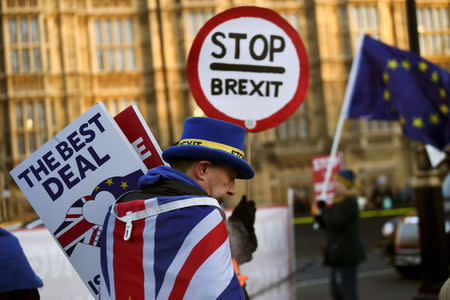 FILE PHOTO: An anti-Brexit protester walks outside the Houses of Parliament in London, Britain January 17, 2019. REUTERS/Clodagh Kilcoyne/File Photo