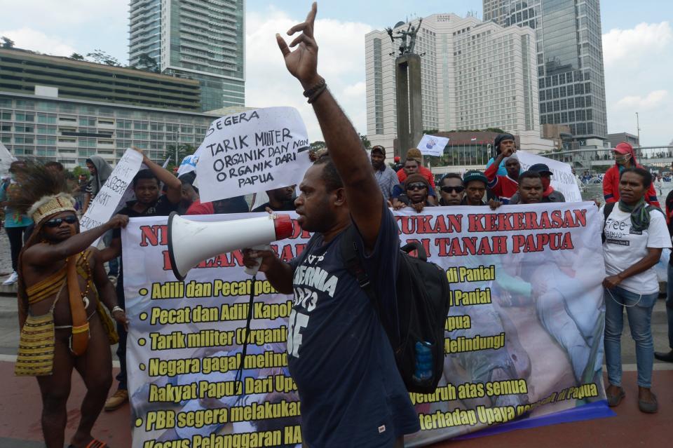 A Papuanese activist delivers speech during a protest against the fatal shooting of teenagers during clashes with security forces in Enarotali, at the Hotel Indonesia roundabout in Jakarta on Dec. 10, 2014.