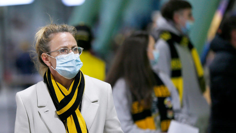 Seen here, Richmond fans are seen wearing masks before the round 16 clash against Gold Coast. 