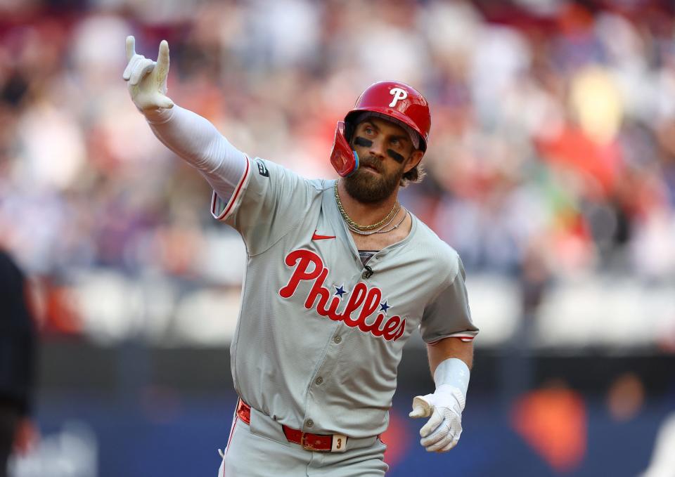 Bryce Harper celebrates after hitting a home run against the New York Mets during a London Series game.