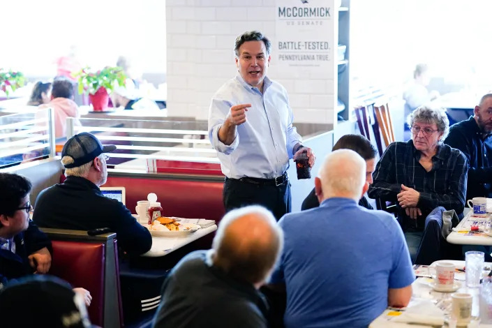 Dave McCormick, a Republican candidate for U.S. Senate in Pennsylvania, meets with attendees during a campaign event at the Round the Clock Diner in York, Pa., Monday, April 4, 2022. (Matt Rourke/AP)