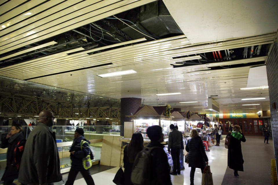 FILE — In this March 19, 2015 file photo, large panels of the ceiling are missing at the Port Authority Bus Terminal in New York. New York City's main bus terminal, long ridiculed for leaky ceilings, dirty bathrooms and frequent delays, could be in for a major overhaul. The Port Authority of New York and New Jersey unveiled a plan Thursday, Jan. 21, 2021, to rebuild and expand the embattled midtown Manhattan bus terminal. (AP Photo/Seth Wenig File)